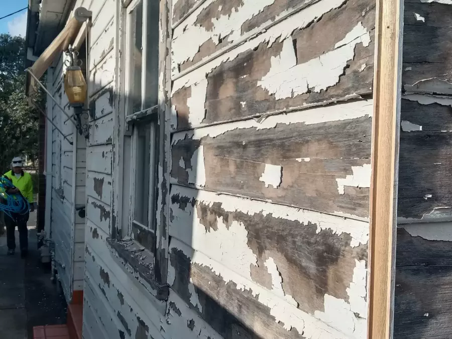 Severely peeling timber weatherboards before surface preparation